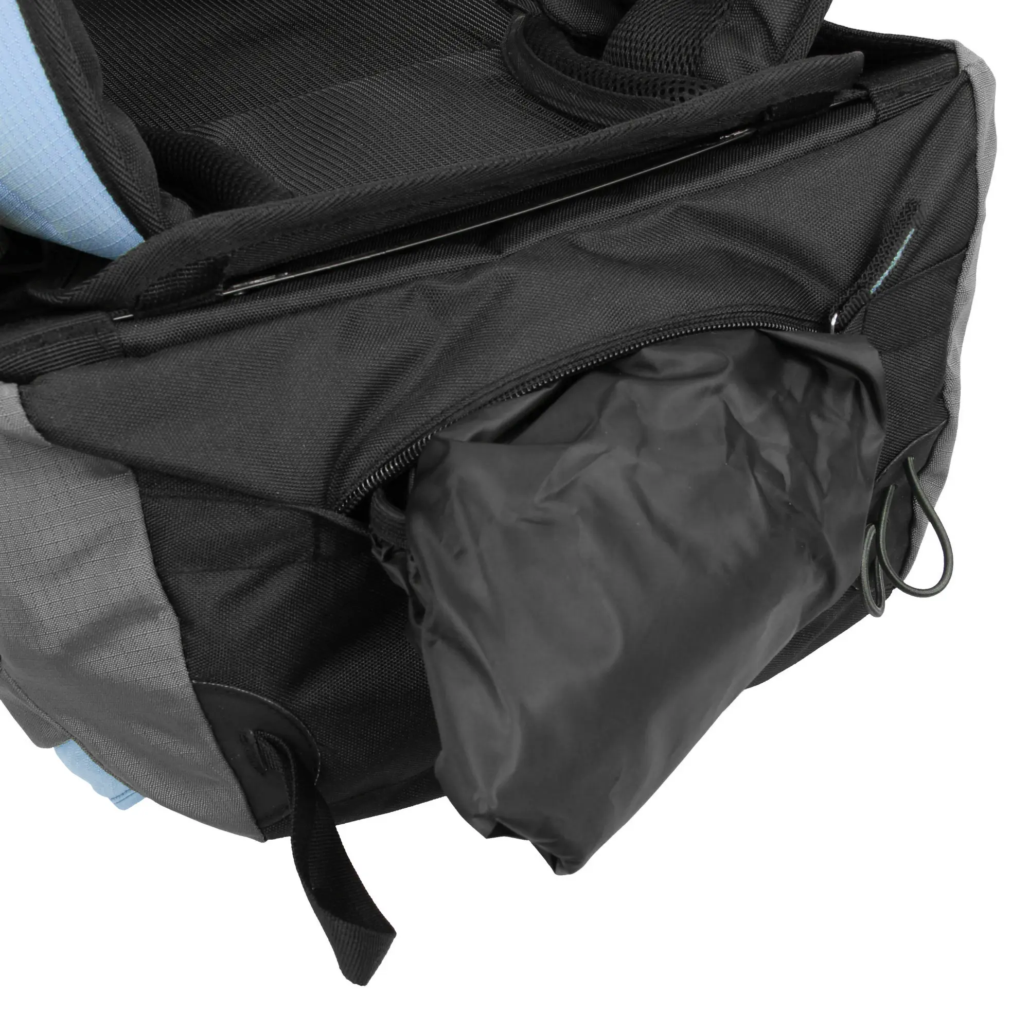 A close-up of a black backpack with a zippered pocket containing a black rain cover, with a gray fabric section and a loop on the side, showing the interior compartments of the bag.