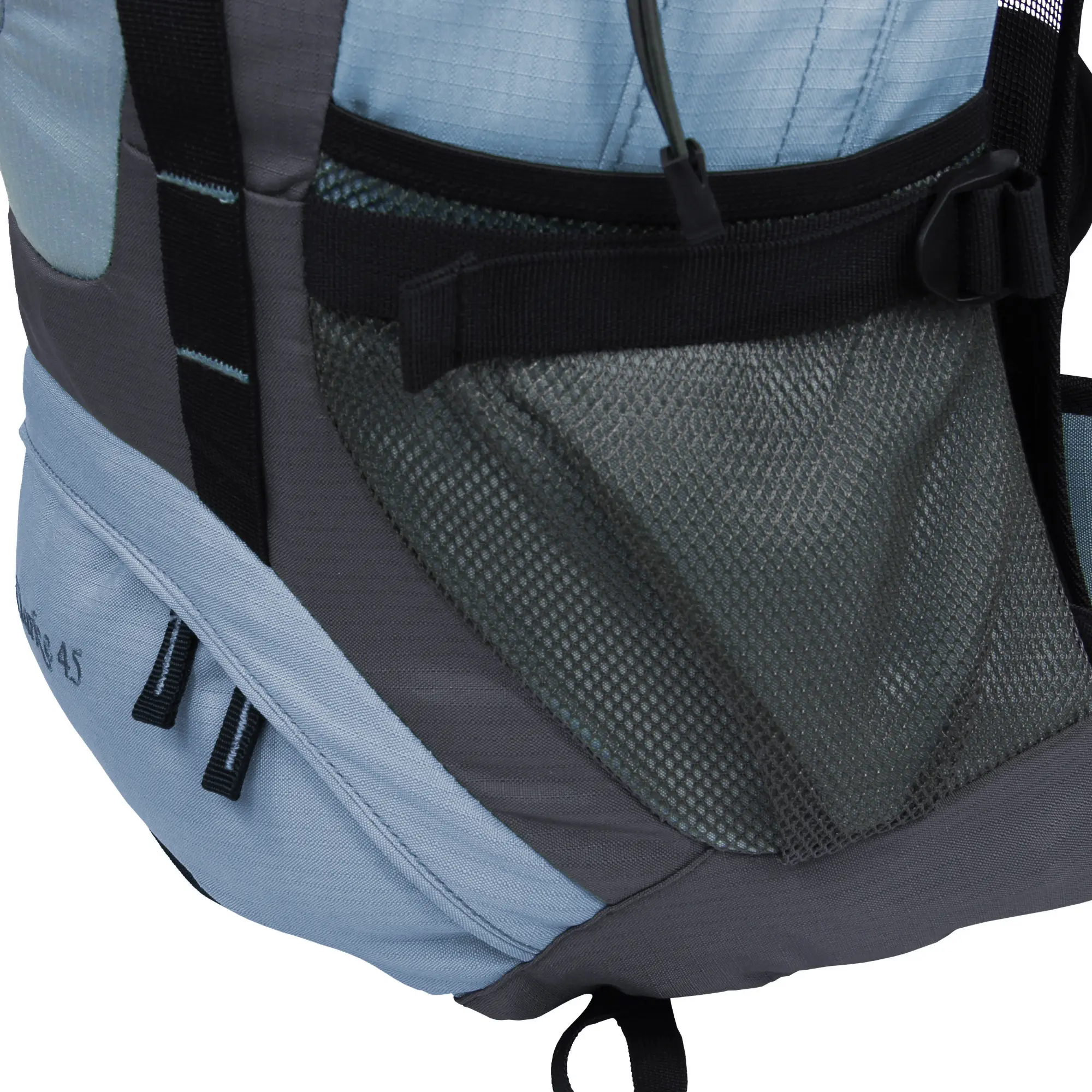 Close-up of a gray and black backpack with multiple zippers and mesh pockets, showing detailed fabric textures and strap attachments.